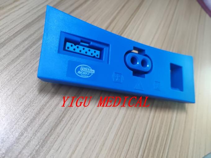 GE CARESCAPE V100 Patient Monitor showing front connector cover with SpO₂ connectivity